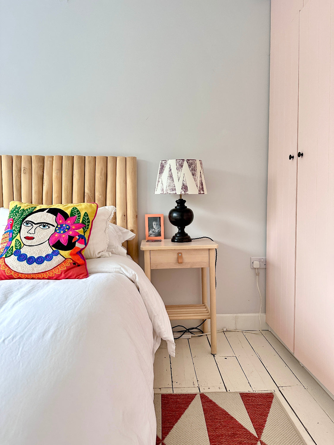 Bedroom bedside table with bold empire lampshade in burgundy and cream, featuring a striking geometric triangle pattern. This colourful lampshade is great for modern interiors, perfect as empire light shades for table lamps.