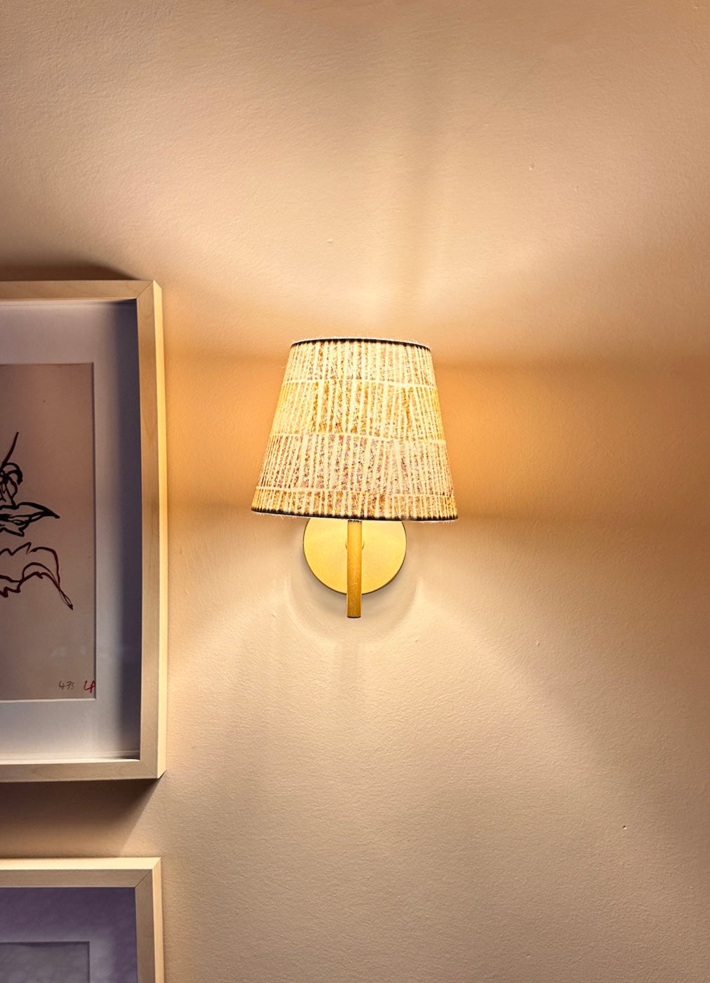 Striped lampshade glowing with warm light, bold lampshade design showcasing colourful striped lighting.