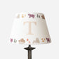 Studio Zef personalised bear lampshade with colourful animal print and large initial 'T'. An empire lampshade designed for kids lighting and thoughtful new parent gifts.
