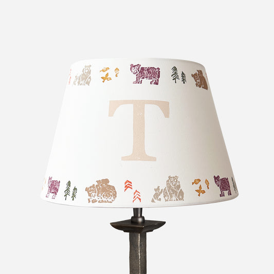 Studio Zef personalised bear lampshade with colourful animal print and large initial 'T'. An empire lampshade designed for kids lighting and thoughtful new parent gifts.