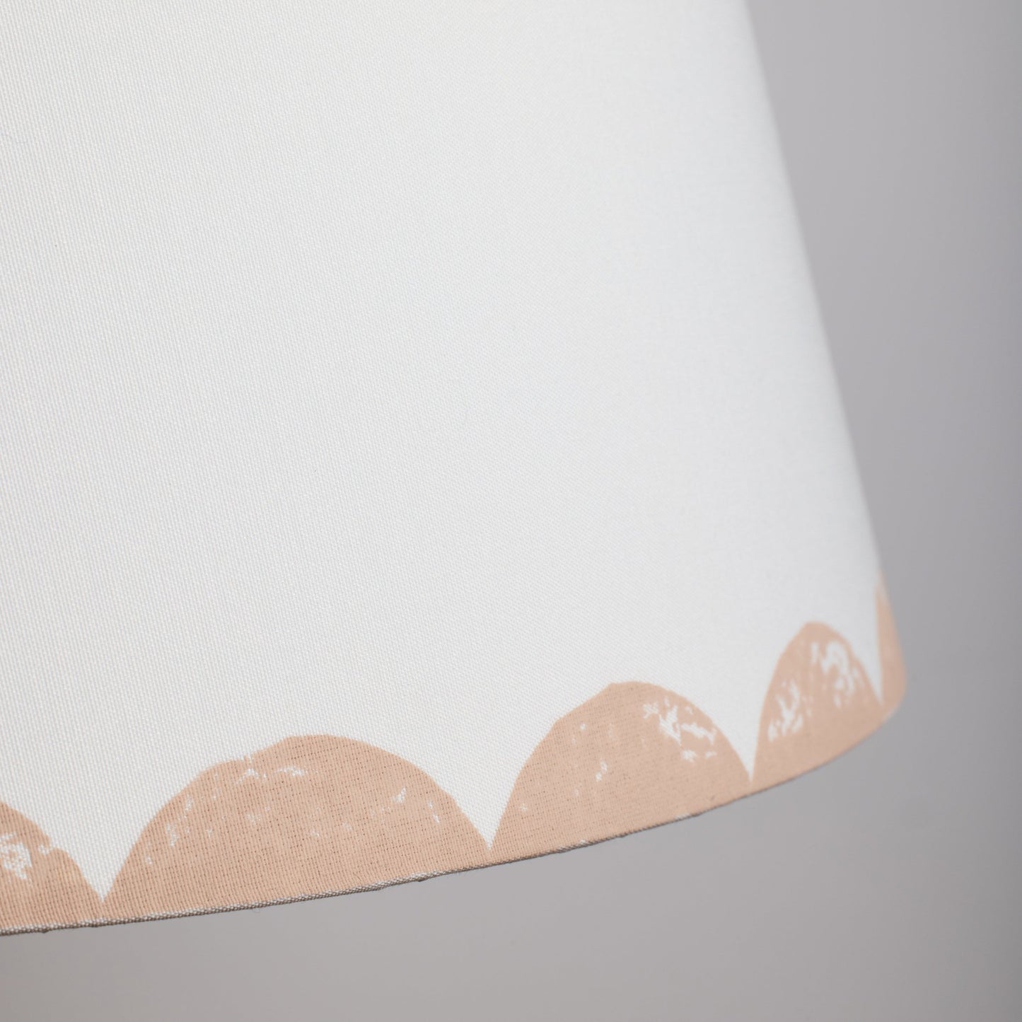 Close up of pink scallop lampshade