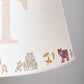Close-up of kids bear lampshade showing hand-printed bears and woodland details. A personalised lampshade and animal lampshade for kids bedrooms, perfect as a personalised kids gift.
