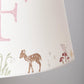 Close up of personalised girls lampshade with woodland animals printed around the top and bottom, and a letter printed in the middle