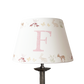 Personalised girls lampshade with woodland animals printed around the top and bottom, and a letter printed in the middle