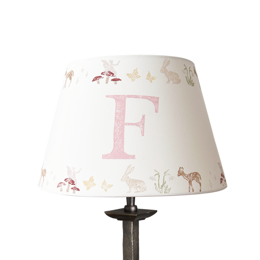 Personalised girls lampshade with woodland animals printed around the top and bottom, and a letter printed in the middle