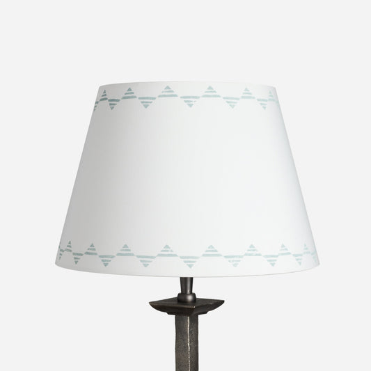 Empire lampshade in cream cotton with a blue triangle pattern, a geometric lampshade design shown on a plain white background.