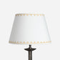 Full product image of the Lined Trigon Lampshade in a soft cream fabric, decorated with a neat yellow triangle border. The empire lampshade showcases a geometric lampshade design perfect for both classic and contemporary interiors.