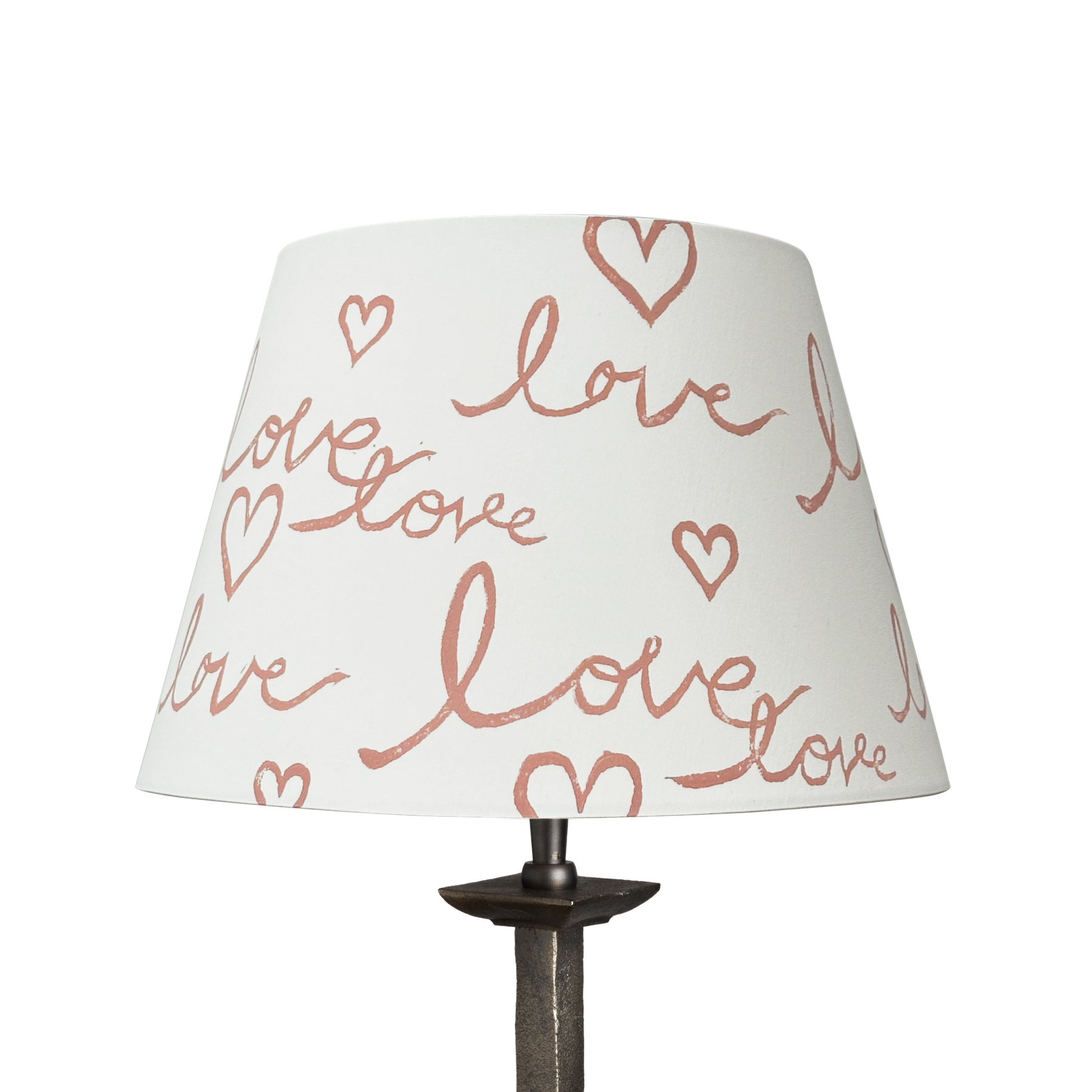 Handmade empire-shaped lampshade with a block-printed design featuring the handwritten word "love" and heart motifs. The lampshade is made from cream cotton and has a modern, romantic aesthetic.