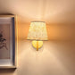 Striped lampshade glowing with warm light, bold lampshade design showcasing colourful striped lighting.